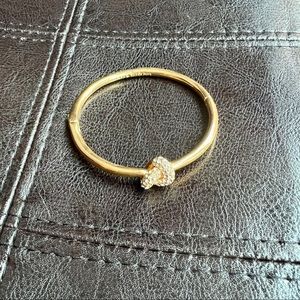 Kate Spade knot bracelet in gold tone with pavé crystals
